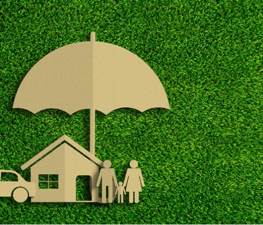 Paper cutout of family, house and car under an umbrella, representing personal insurance